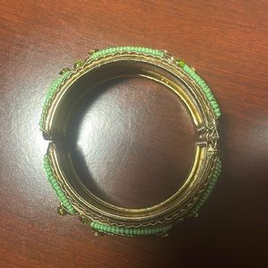 Gold bracelet w/ green beading